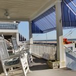 rocking chairs on inn porch with oceanfront view