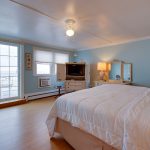 Oceana room with full size bed overlooking the ocean