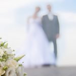 Inn On The Ocean Weddings Bride and Groom on Beach with bouqet