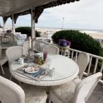 Photo of the porch area of Inn on the Ocean